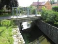 Betonová mostní konstrukce na Jiříkovském potoce v ř. km 1,74 - místo omezující odtokové poměry