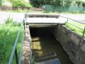 Betonová mostní konstrukce na Jiříkovském potoce v ř. km 2,61 - místo omezující odtokové poměry
